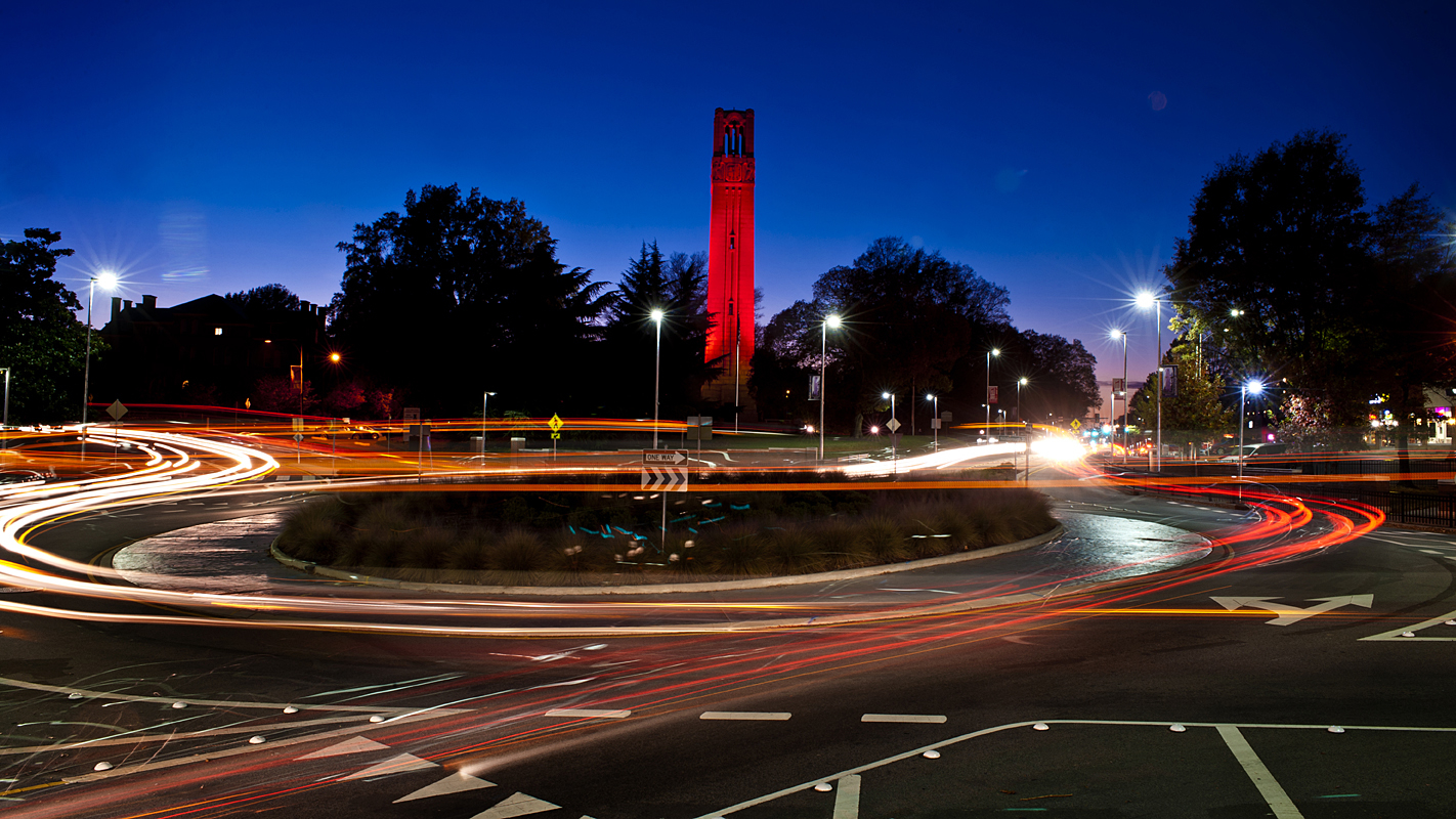 Memorial Belltower lit red at night