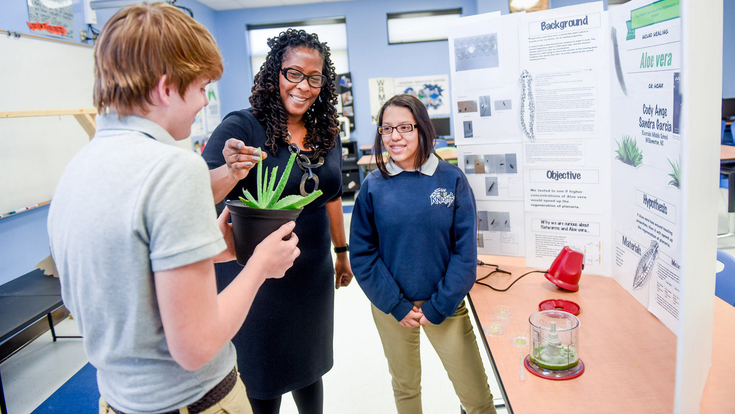 middle school science teacher with students