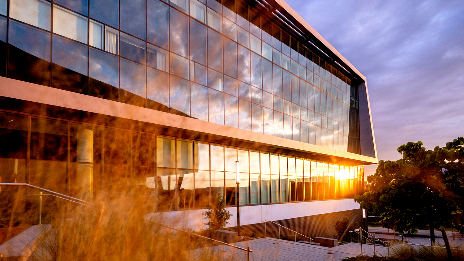 The sun sets on a warm summer evening on Centennial Campus at the Hunt Library